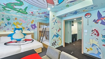 A child's room with a bunk bed, a plush toy, and walls decorated with cartoon characters.