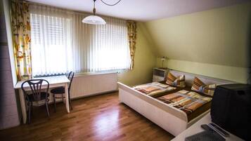 Desk, blackout drapes, iron/ironing board (on request), travel crib