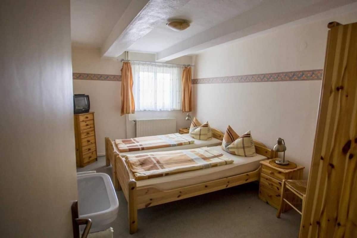 Desk, blackout curtains, iron/ironing board (on request), travel cot
