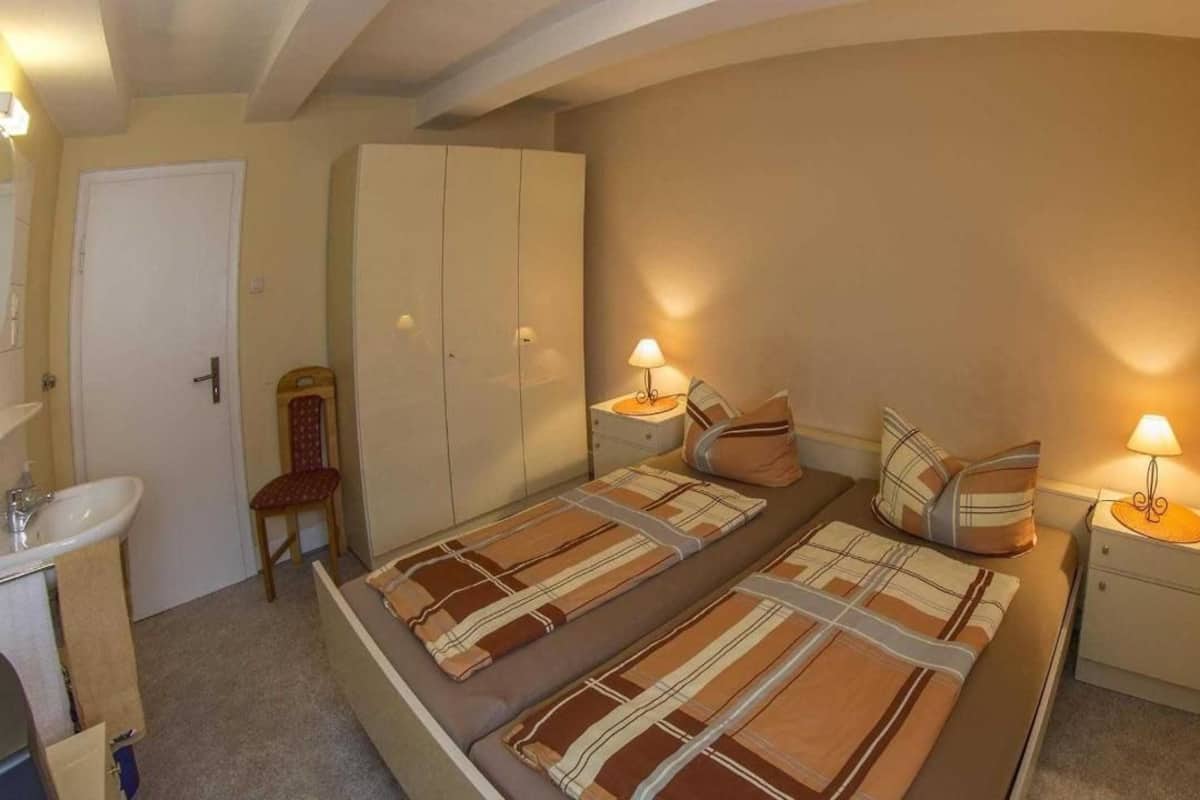 Desk, blackout curtains, iron/ironing board (on request), travel cot