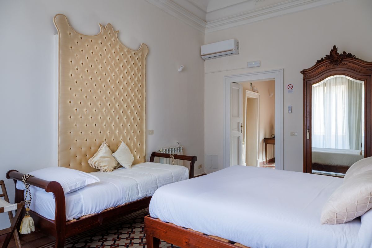 Triple Room, Shared Bathroom | 1 bedroom, blackout drapes, free cribs/infant beds, free WiFi