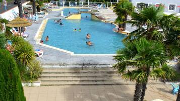 Indoor pool, seasonal outdoor pool, pool umbrellas, pool loungers