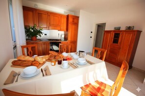 Apartment, 2 Bedrooms | Private kitchen | Full-size fridge, oven, stovetop, cookware/dishes/utensils