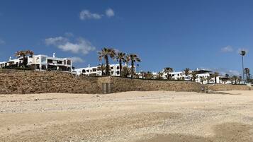 Private beach nearby, beach umbrellas