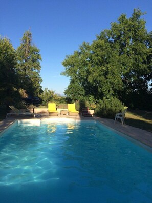 Seasonal outdoor pool, open 9:00 AM to 8:00 PM, pool umbrellas