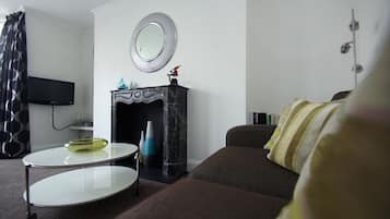 Departamento | Área de sala de estar | Televisión de pantalla plana y reproductor de DVD