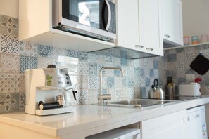 Apartment, 1 Bedroom | Private kitchen | Fridge, microwave, stovetop, cookware/dishes/utensils - Bernini (Naples)