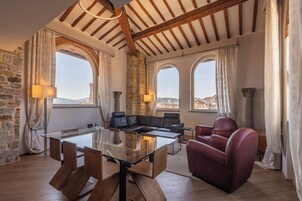 Panoramic Suite, 1 Bedroom, Hot Tub (Lorenzo il Magnifico) | Living area | 65-inch flat-screen TV with satellite channels, TV, heated floors