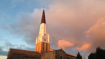 A church with a tall spire and a clock tower.