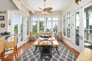 Enjoy meals with family and friends in this dining area, featuring a large table and comfortable seating for six.