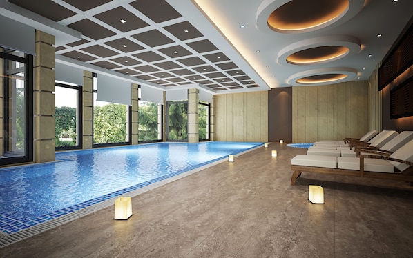 Indoor pool, pool umbrellas, sun loungers