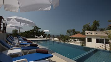 Outdoor pool, free pool cabanas, pool umbrellas