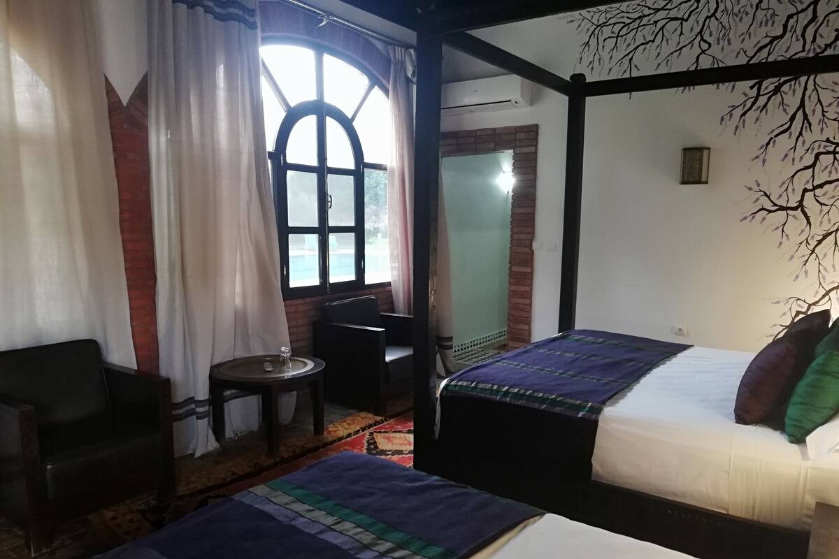 Desk, blackout curtains, bed sheets