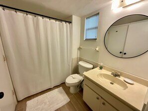 Bathtub, hair dryer, towels