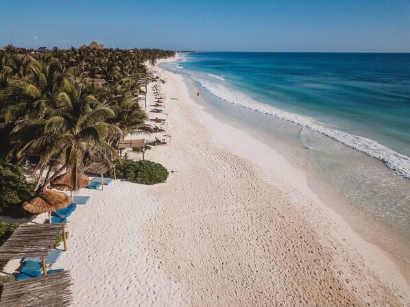 On the beach, sun-loungers, beach towels