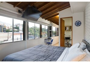 Business Studio Suite, 1 King Bed, Hot Tub, Mountain View | In-room safe, individually furnished, desk, iron/ironing board