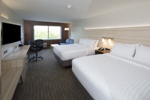 A hotel room with two beds, a desk with a flat-screen TV, a chair, and a window with a view. - Holiday Inn Express & Suites Auburn by IHG (Auburn)