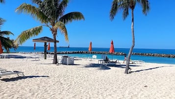 On the beach, sun-loungers, beach towels