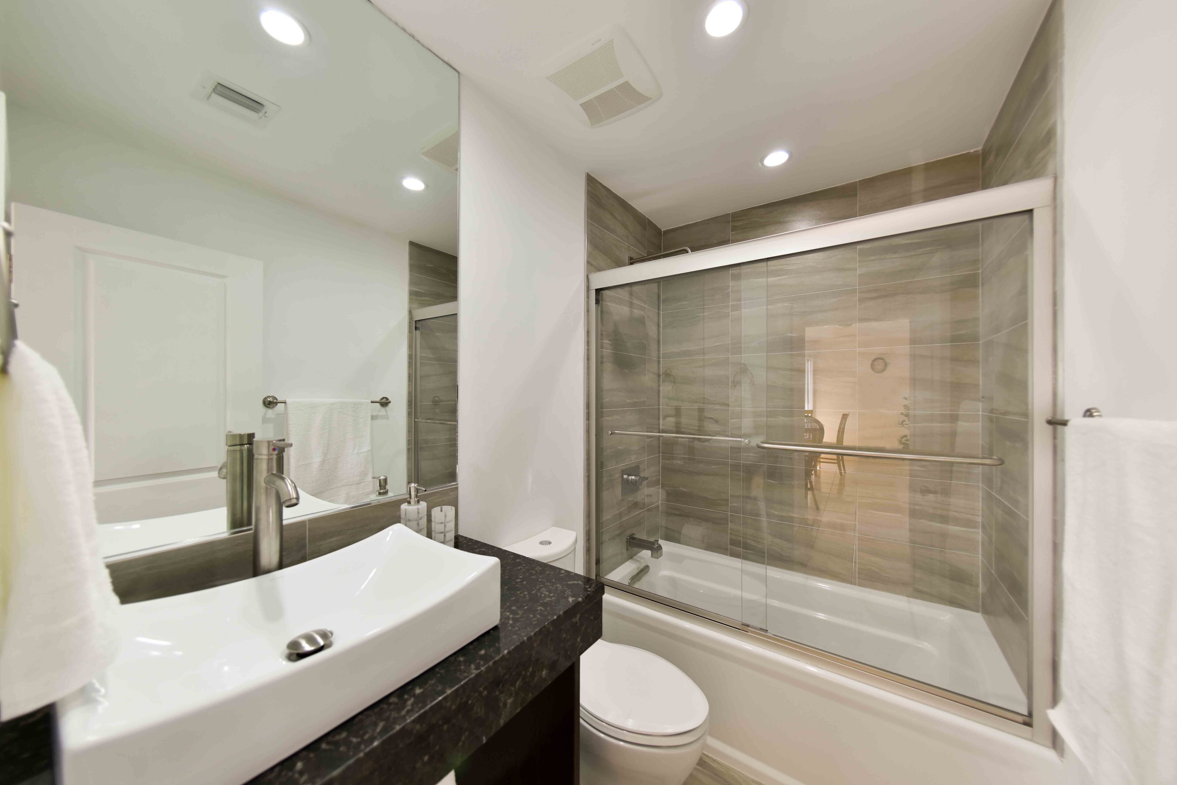 Combined shower/bathtub, hair dryer, towels, soap