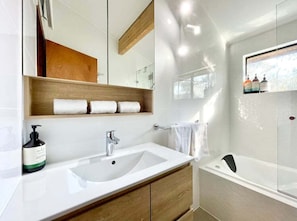 Shower, hair dryer, towels, soap