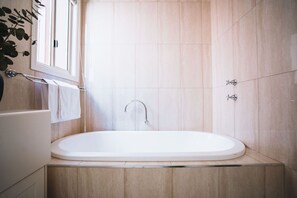 Bathtub, hair dryer, towels