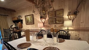 A dining table set with white tablecloth, glassware, and woven placemats. - Four Seasons Private Suite on Chestnut Ridge in Highlands - Private Club Access (Highlands)