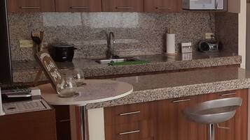 Fridge, microwave, stovetop, coffee/tea maker