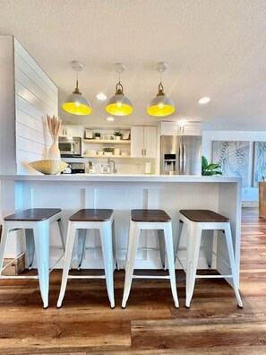 Fridge, microwave, stovetop, coffee/tea maker