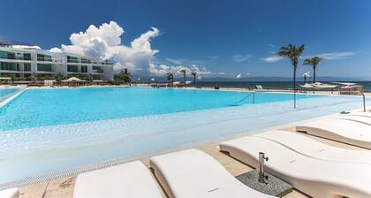 BEACHFRONT familial !!!!! Piscines incroyables et meilleure plage autour!