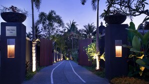 A pathway leading to a gated entrance with a sign reading "Alam Bulan Villa." - Elegant, Intimate, Luxury Contemporary Balinese Villa  In a Traditional Village  (Kemenuh, Sukawati,)