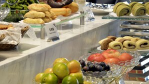 A buffet with various food items including fruits, pastries, and desserts. - Mercure Taiyuan Changfeng Street (Taiyuan)