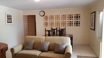 Basic Apartment, 2 Bedrooms, Non Smoking | Living room | 32-inch flat-screen TV with cable channels, TV