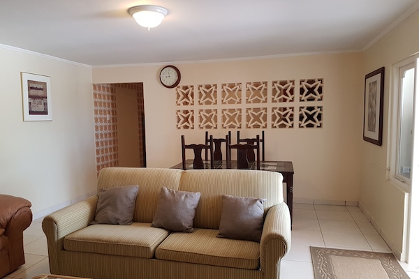 Basic Apartment, 2 Bedrooms, Non Smoking | Living room | 32-inch flat-screen TV with cable channels, TV