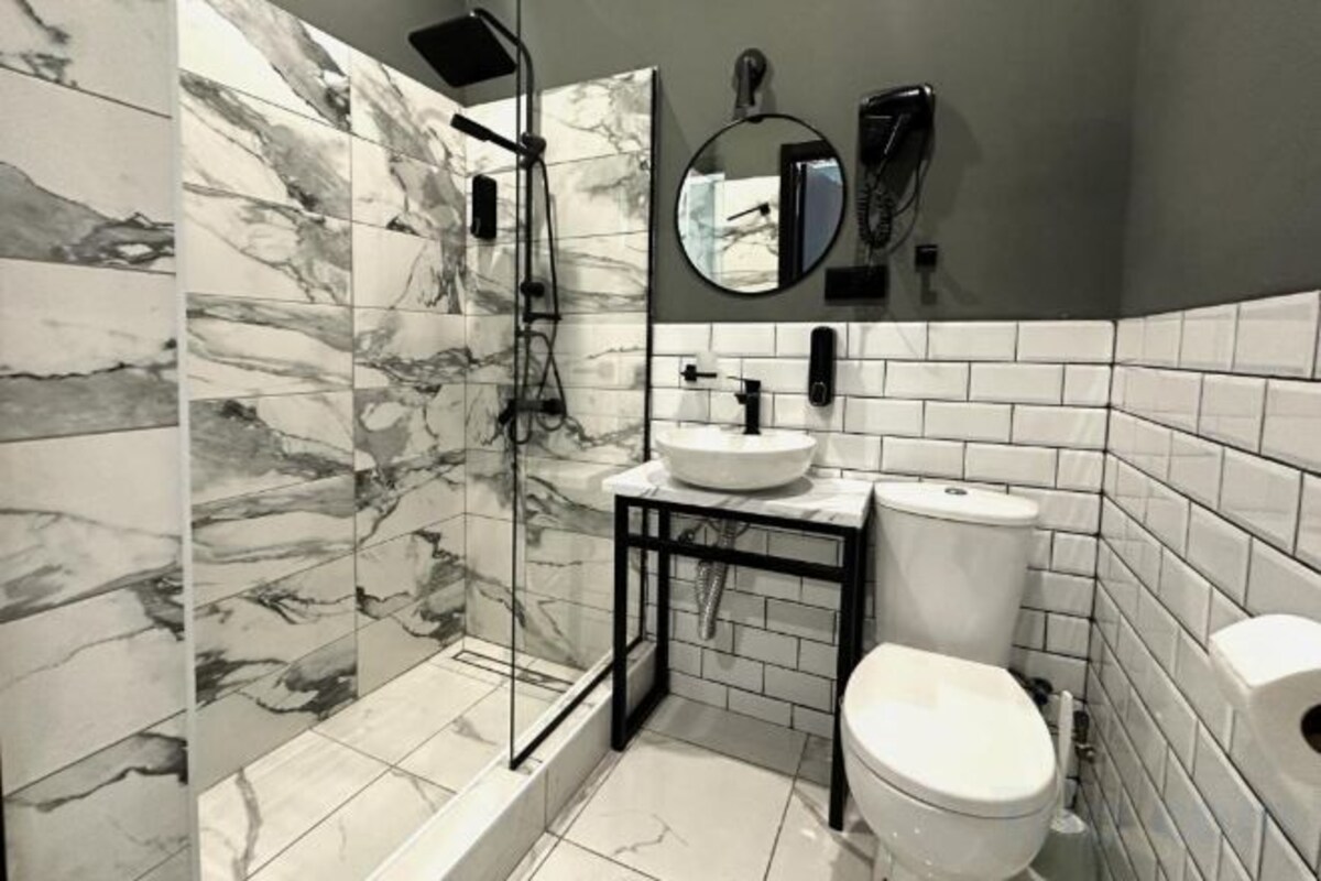 Bathroom | Shower, free toiletries, hair dryer, slippers