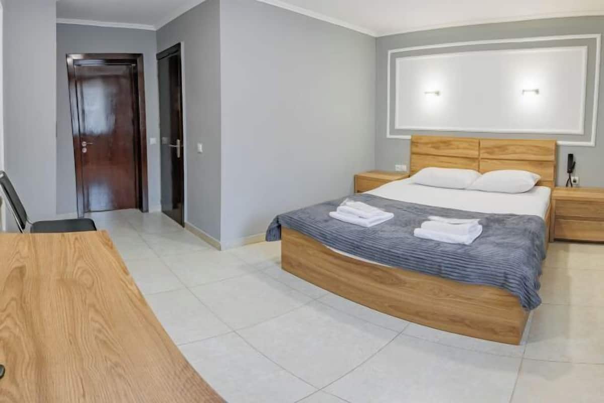 Premium bedding, pillowtop beds, laptop workspace, blackout drapes
