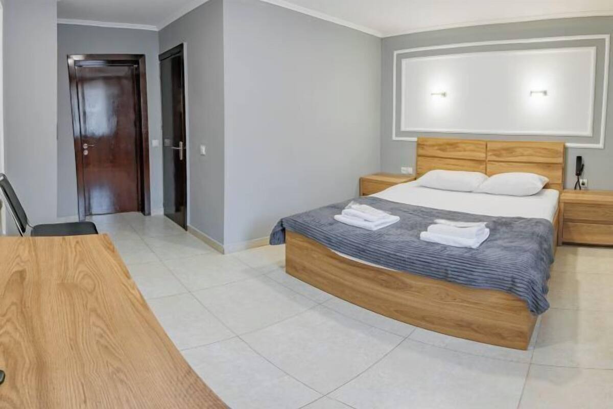 Premium bedding, pillowtop beds, laptop workspace, blackout drapes