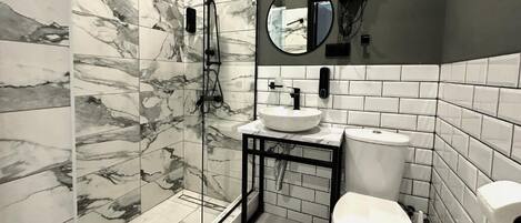 Shower, free toiletries, hair dryer, slippers