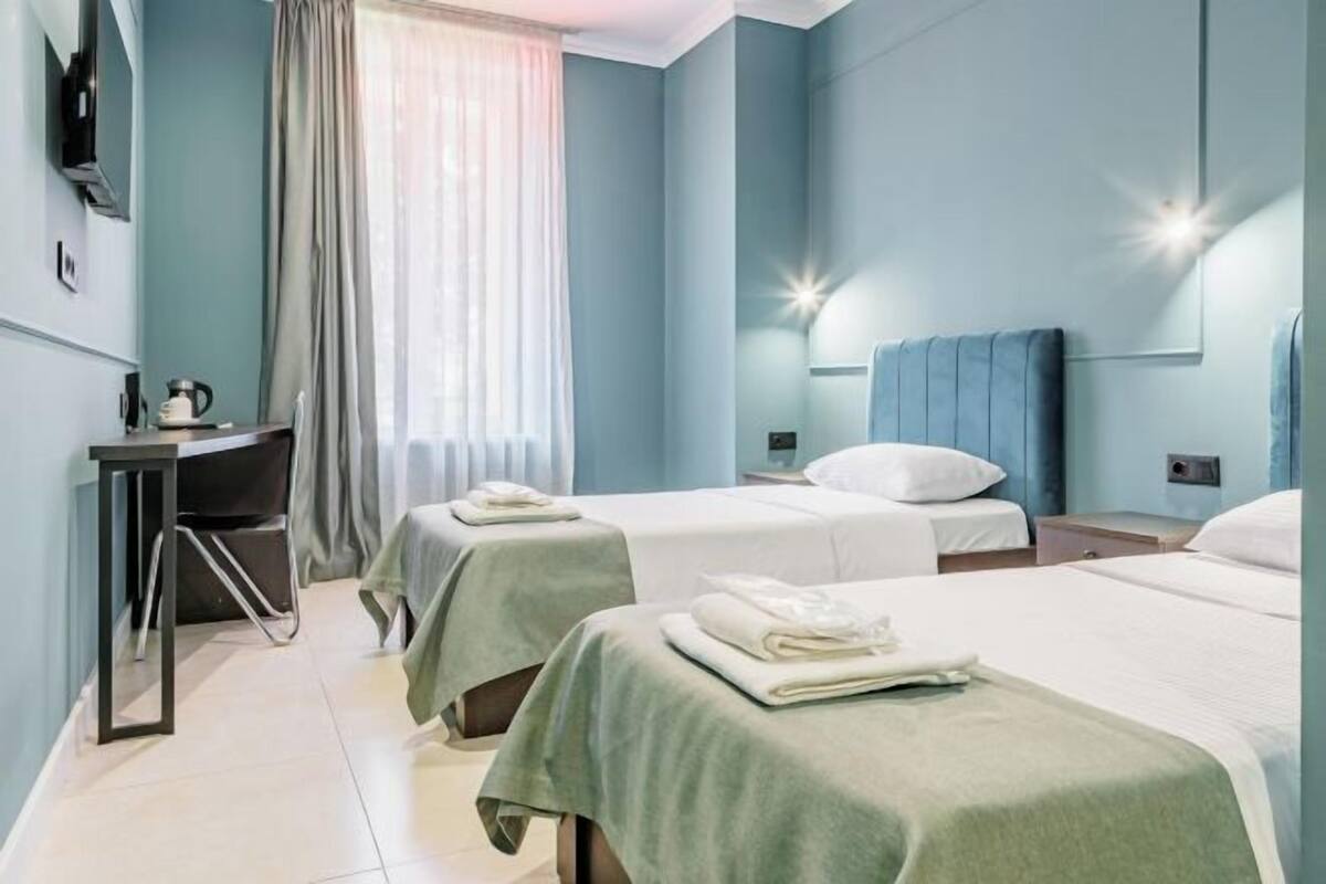 Premium bedding, pillowtop beds, laptop workspace, blackout drapes