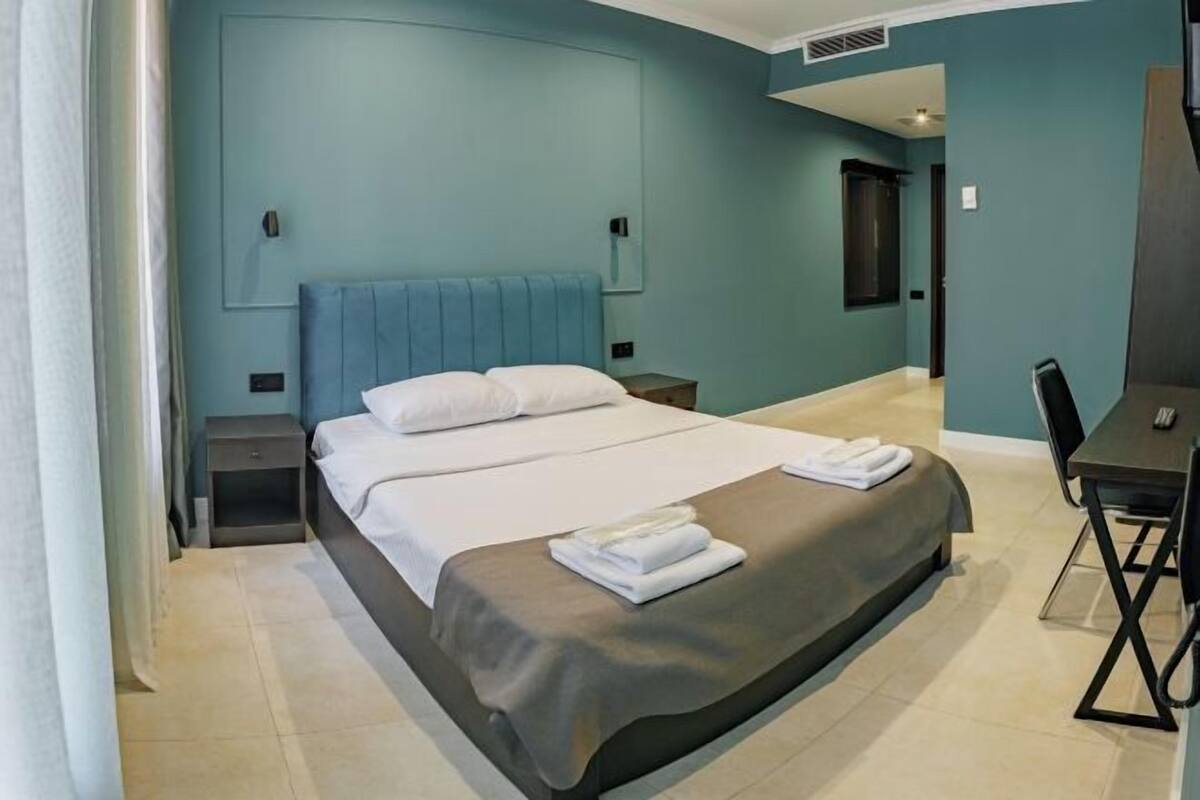 Premium bedding, pillowtop beds, laptop workspace, blackout drapes