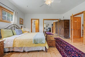 A bedroom with a bed, wooden wardrobe, and a large mirror. - Beautiful home near resort amenities, WIFI (Galena)