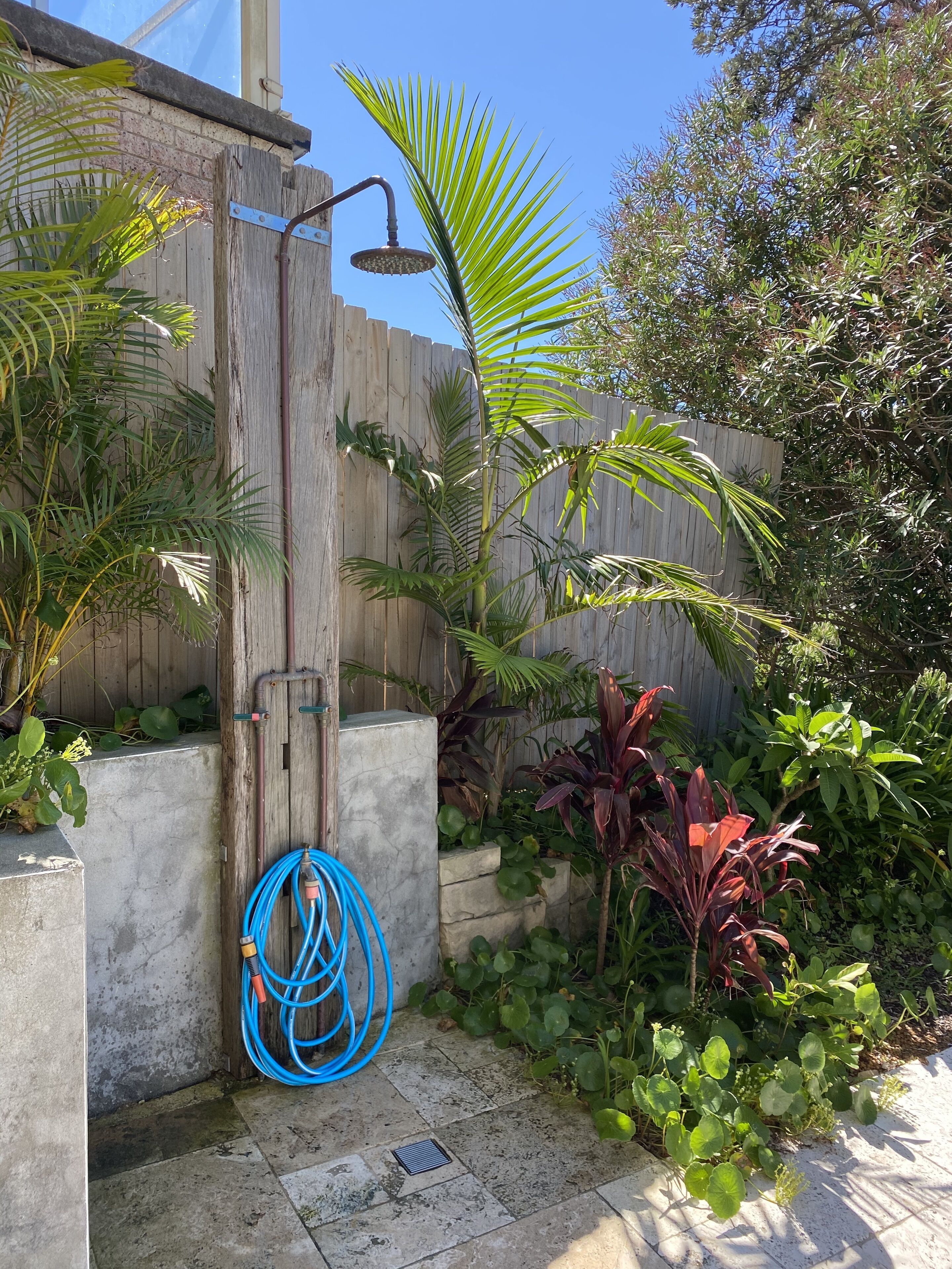 Shower under the bright blue sky (hot and cold water)