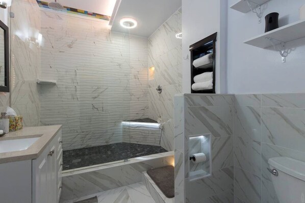 Shower, hair dryer, towels, soap