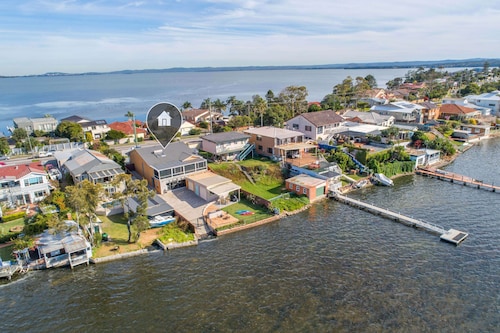 The Toukley Boathouse Direct  Waterfront with  Boat Ramp and Jetty . 

