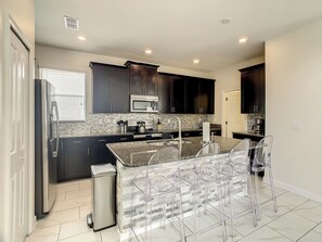 Fridge, microwave, oven, stovetop - 🏝️ 5BR/5BA Home w/ Private Pool & Spa, Themed Kids’ Rooms & Resort Water Park | Storey Lake Near Disney (Kissimmee)
