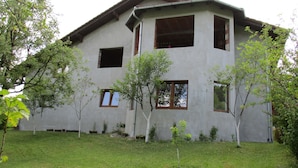 A two-story building with a flat roof and a small front yard. - Peaceful Oasis - House For Rest And Relaxation (Bosanska Krupa)