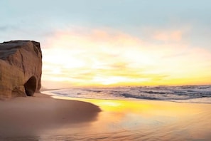On the beach, sun-loungers, beach towels