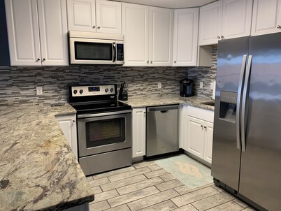 BEAUTIFUL & CLEAN! Waterfront condo with epic sunsets and a POOL!