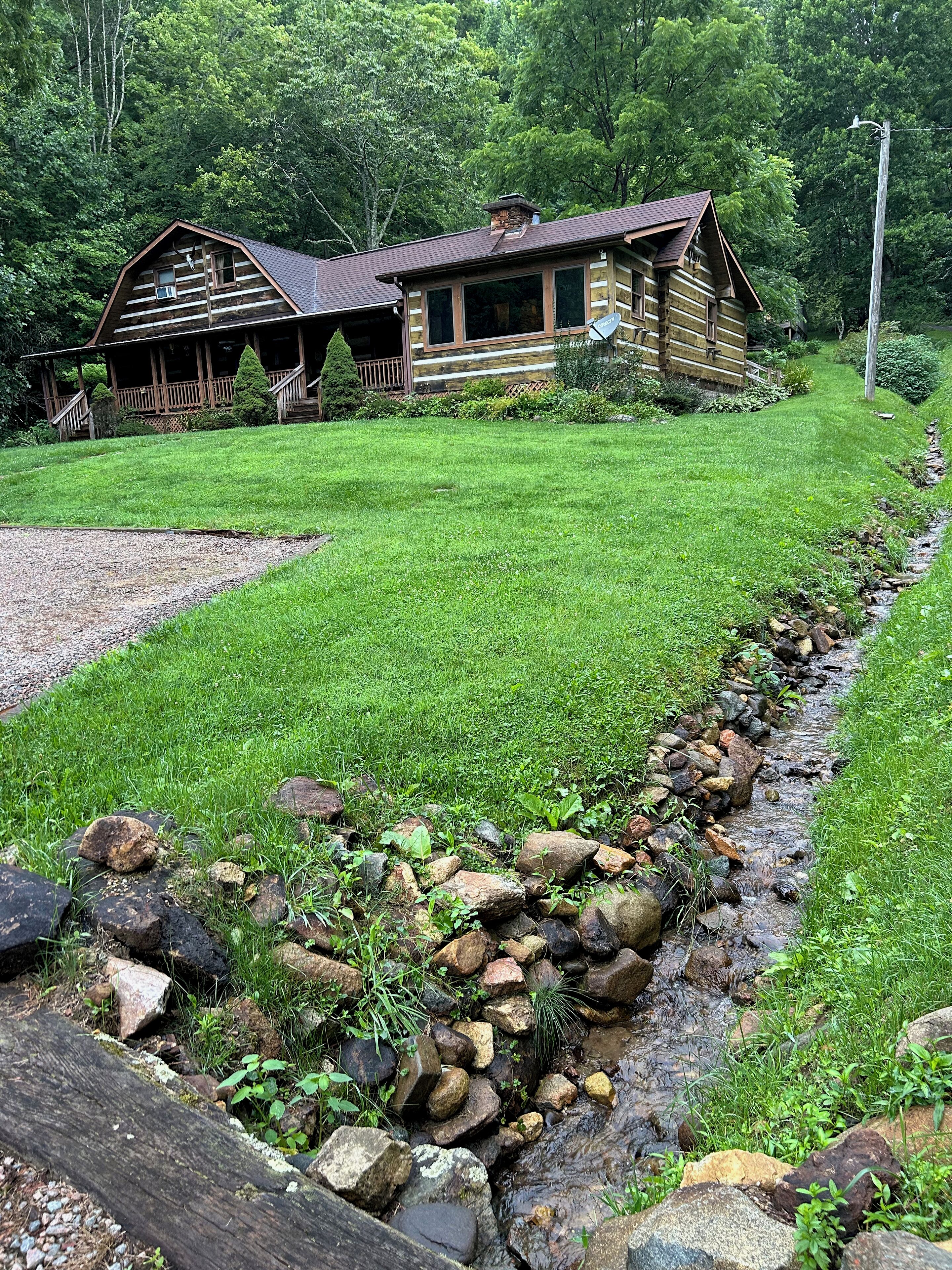 Babbling brooks, soft green grass, chairs on the porch... Welcome to the Cabin