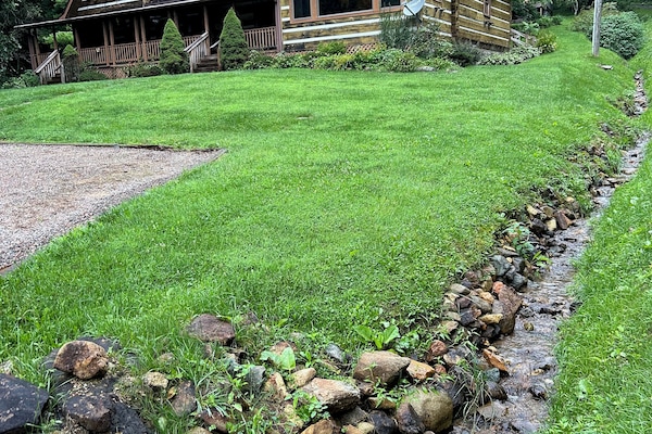 Babbling brooks, soft green grass, chairs on the porch... Welcome to the Cabin