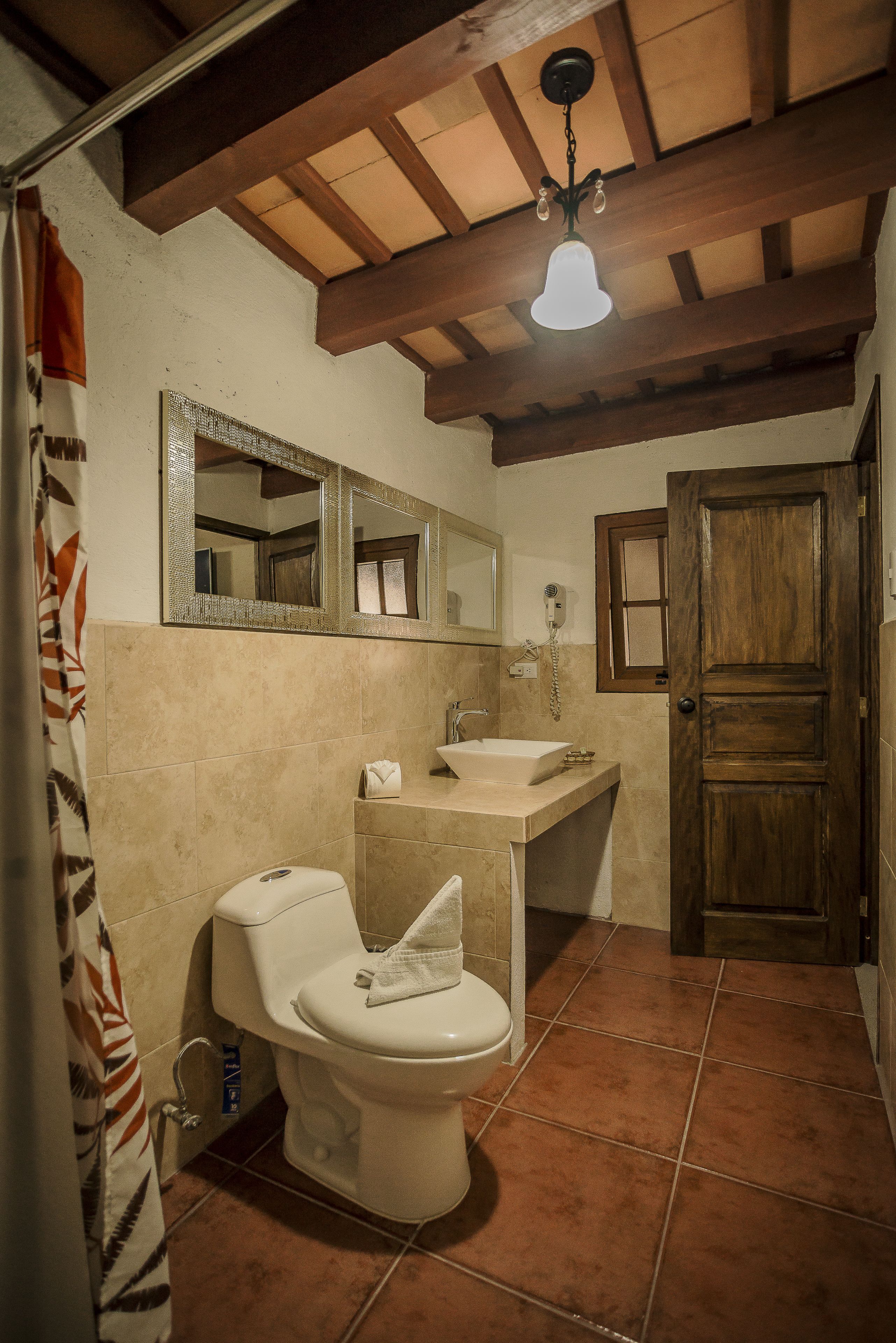 Shower, rainfall showerhead, hair dryer, towels